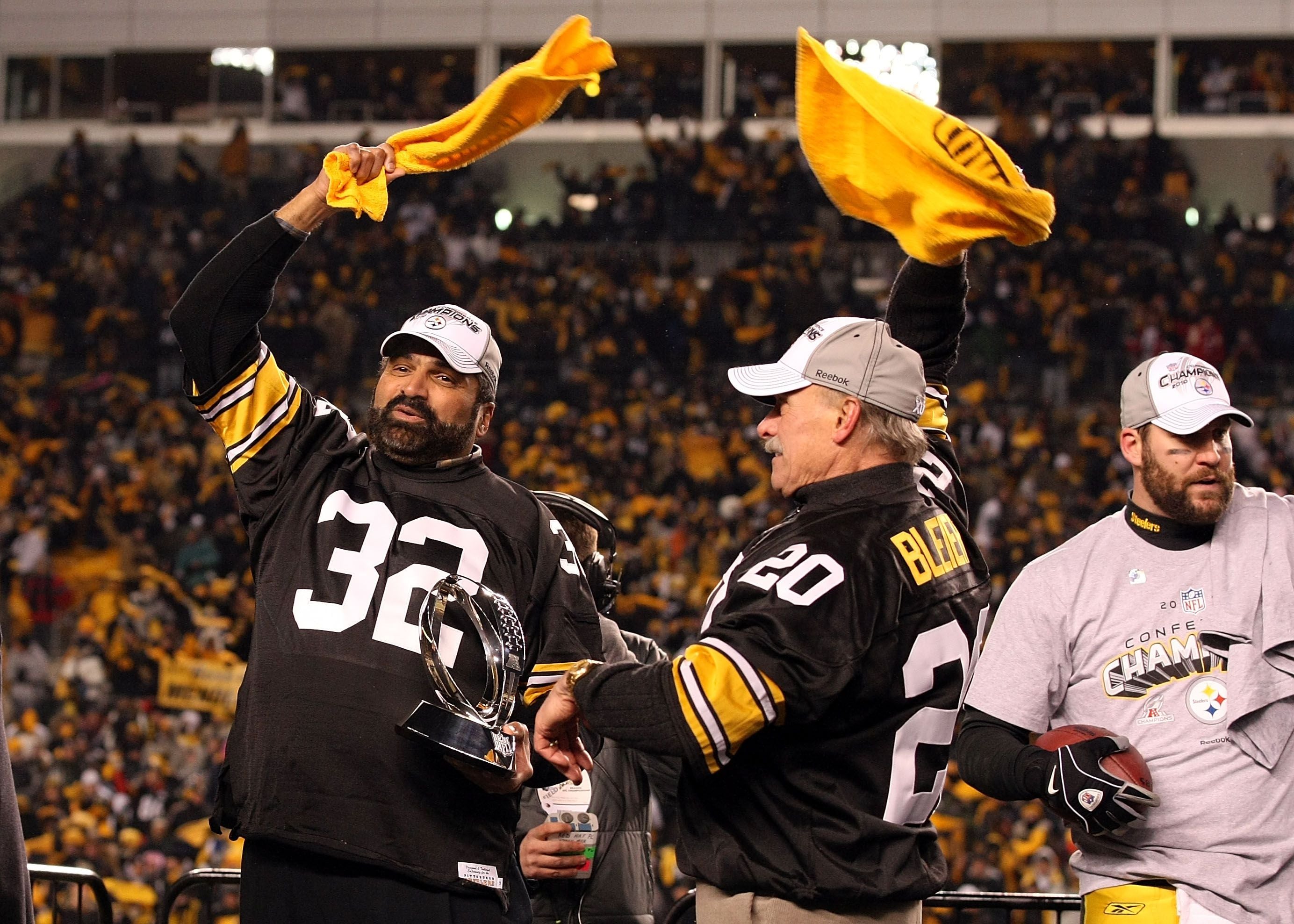 A Pittsburgh Steelers fan waves a terrible towel during the game