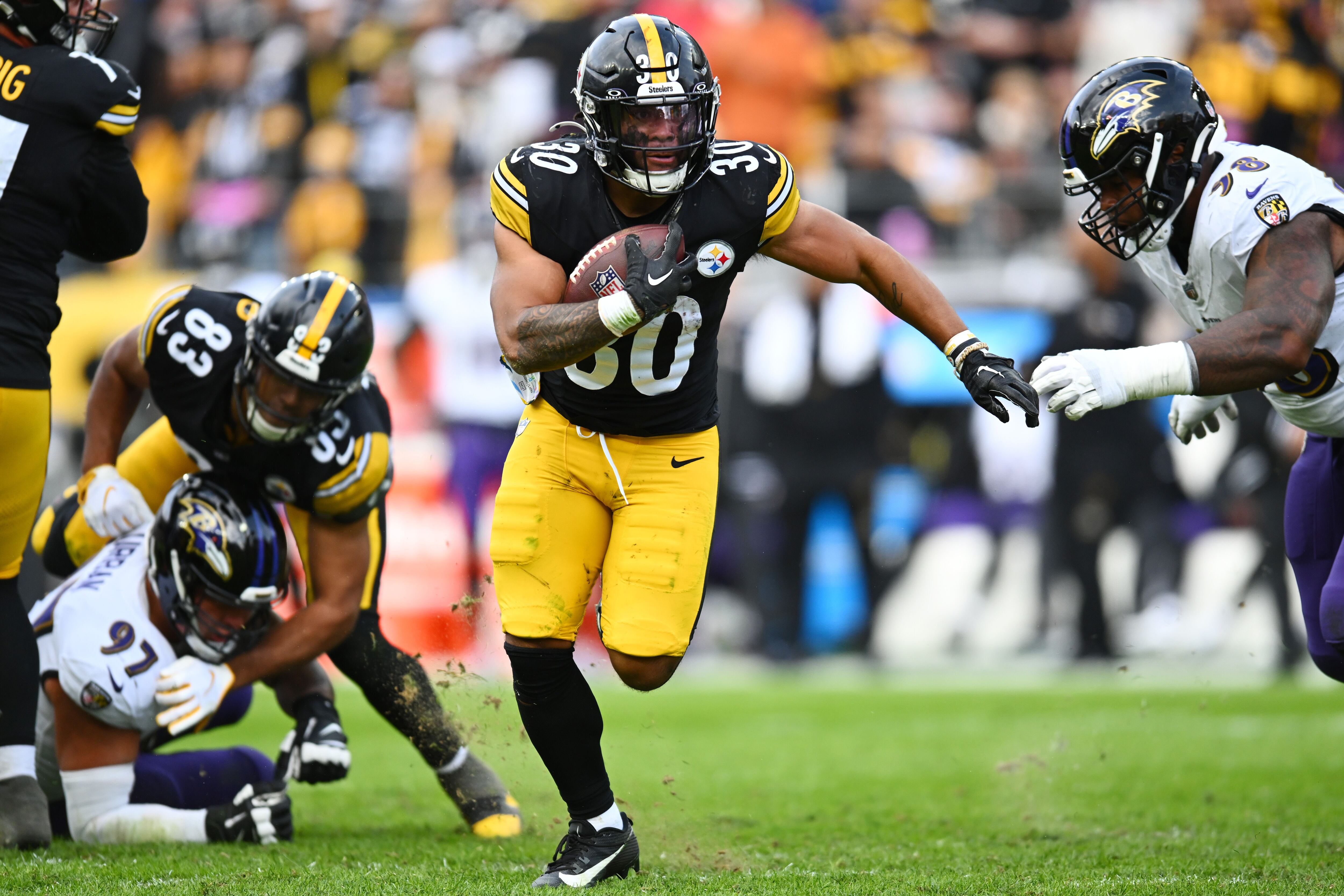 George Pickens of the Pittsburgh Steelers breaks a tackle by Nolan News  Photo - Getty Images