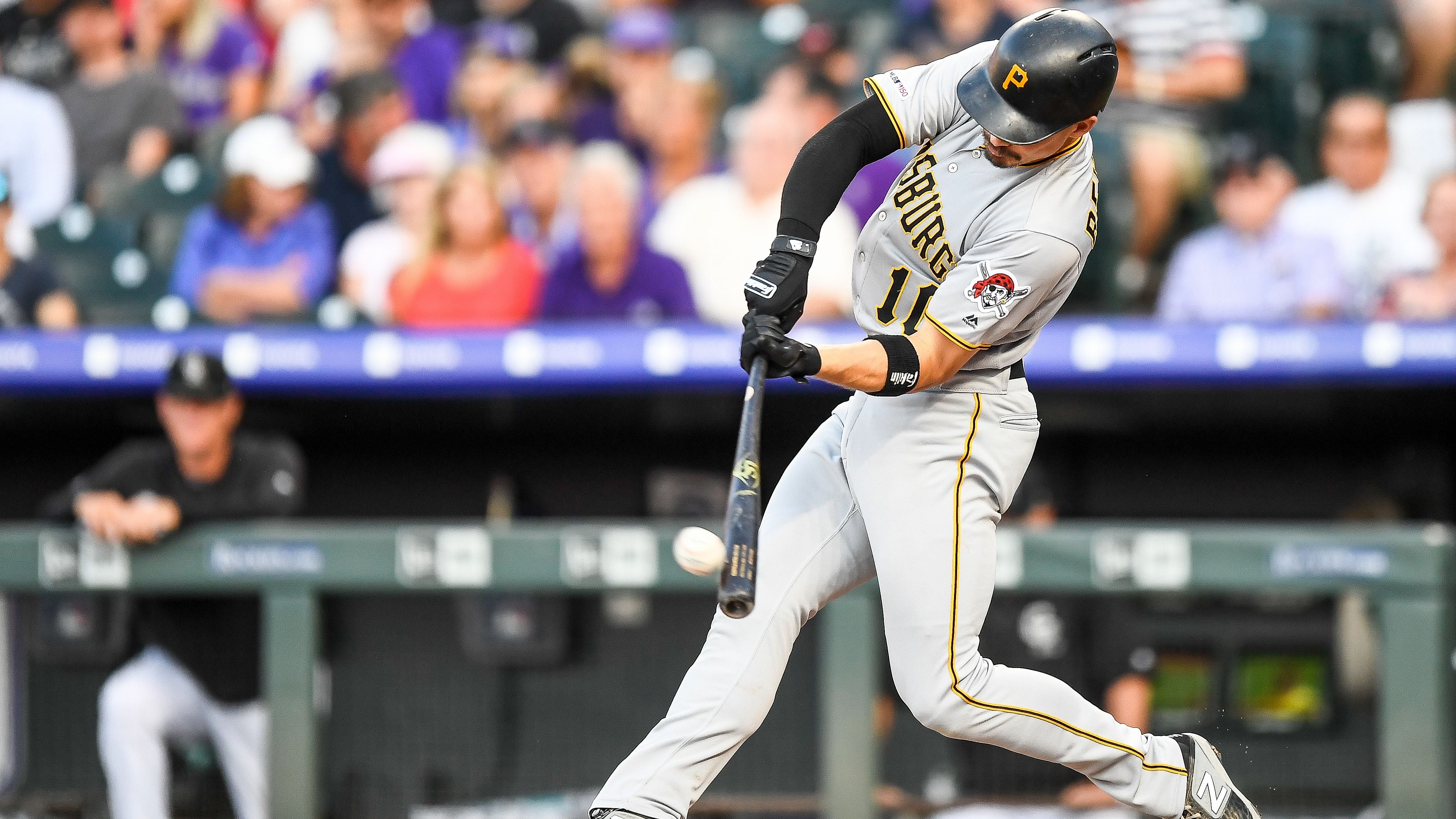 Pittsburgh Pirates center fielder Bryan Reynolds (10) dives for a blooper  single in the second inning of a MLB spring training baseball game against  the New York Yankees in Bradenton, Fla., Thursday